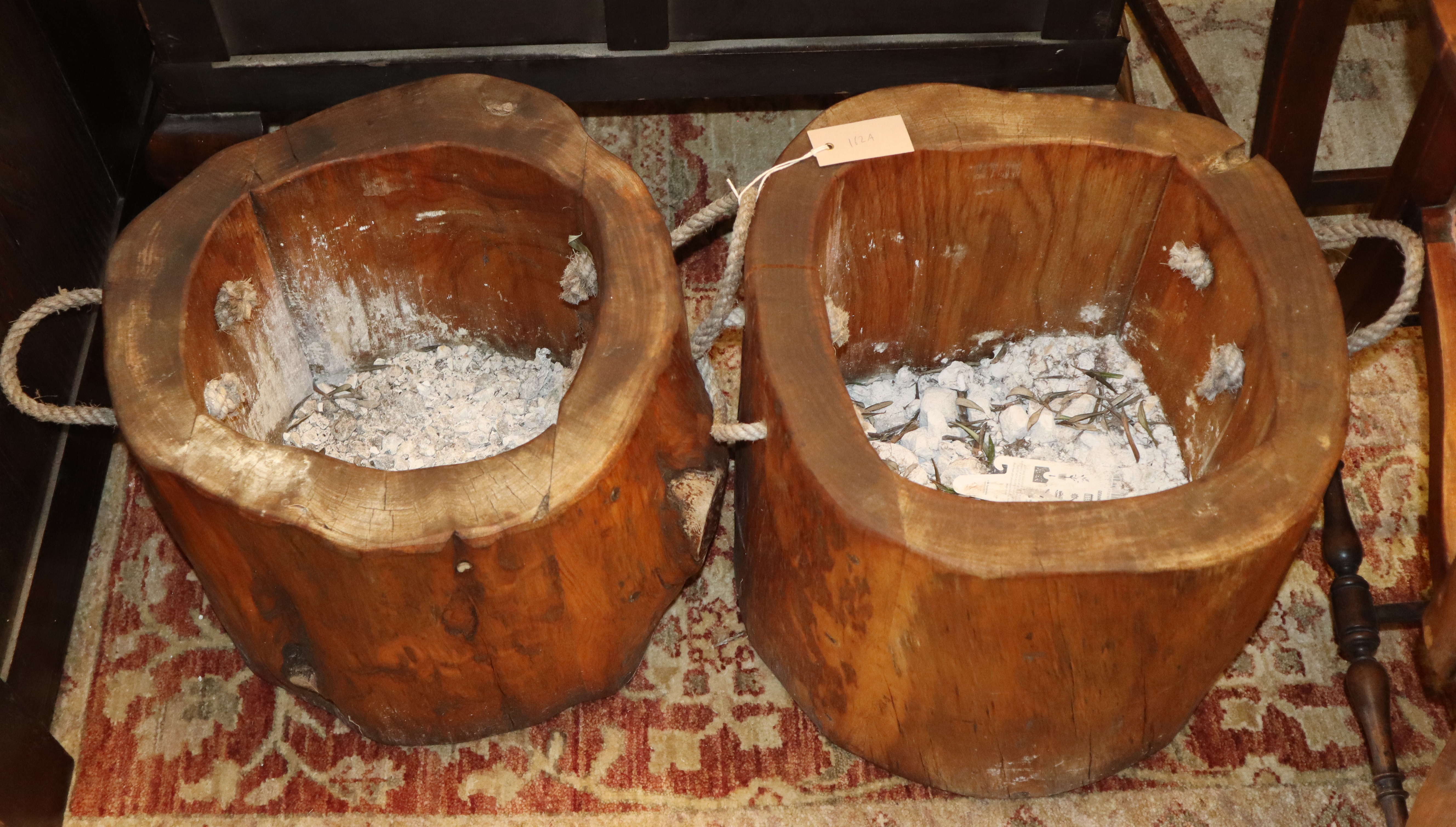 A pair of tree section planters, W.40cm, H.36cm